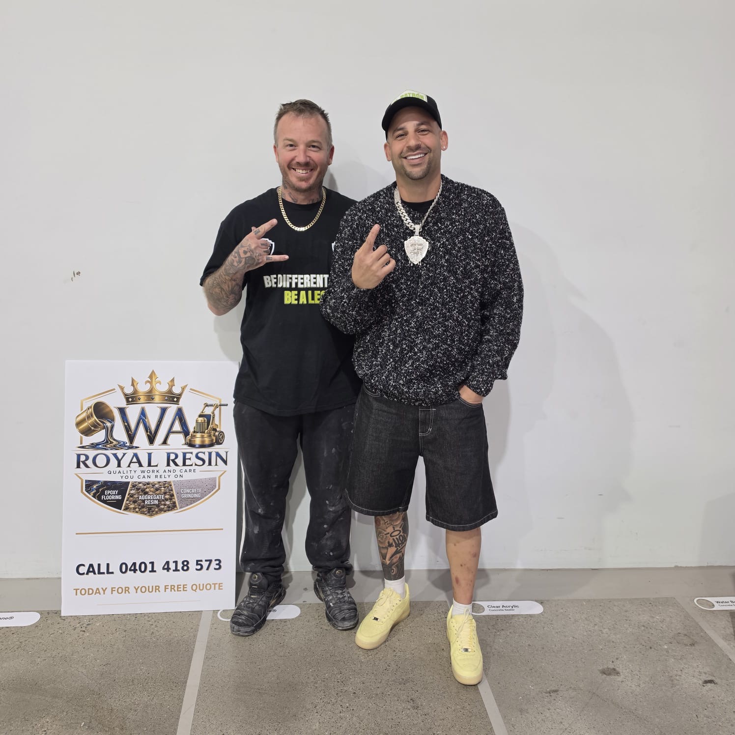 Aaron Box, founder of WA Royal Resin, standing in front of the WA Royal Resin sign with a collaborator