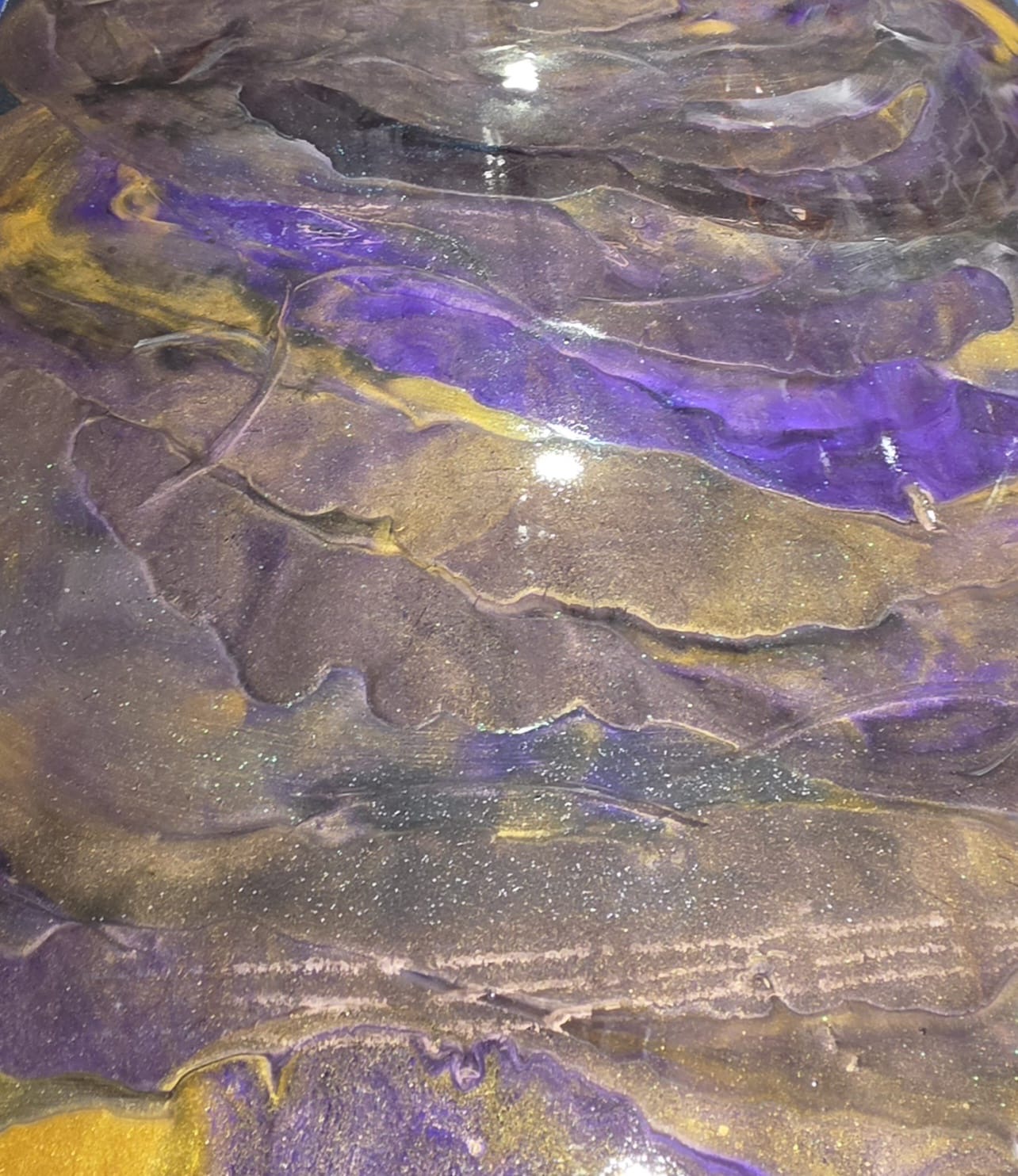 Violet and gold metallic floor with fine glitter suspended in the surface